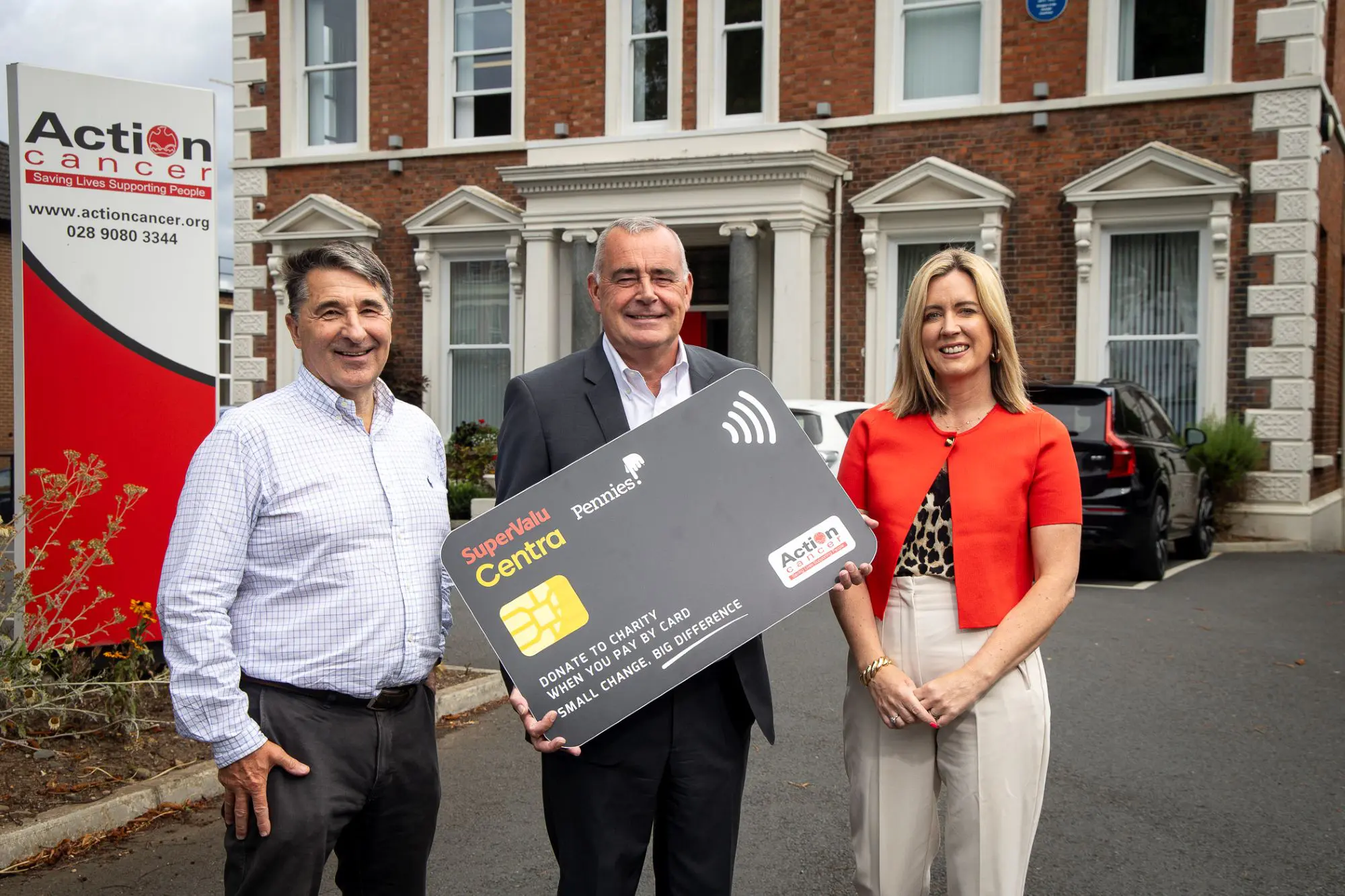 Action Cancer CEO Gareth Kirk, Musgrave Northern Ireland Managing Director Trevor Magill, and Action Cancer Senior Fundraising Manager Lucy McCusker launch a new partnership with fintech charity Pennies